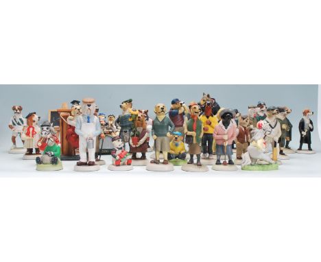 A collection of Robert Harrop ceramic collectable dog figurines to include mostly Country Companions figures all having manuf