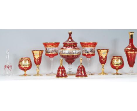 A collection of vintage red / ruby Bohemian glass style vessels to include a lidded vase of bulbous form and a pair of large 