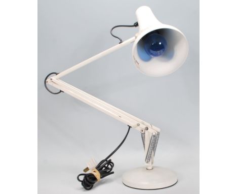 A vintage 20th Century anglepoise desk lamp raised on a round base with pendant lamp shade to top, finished in original white