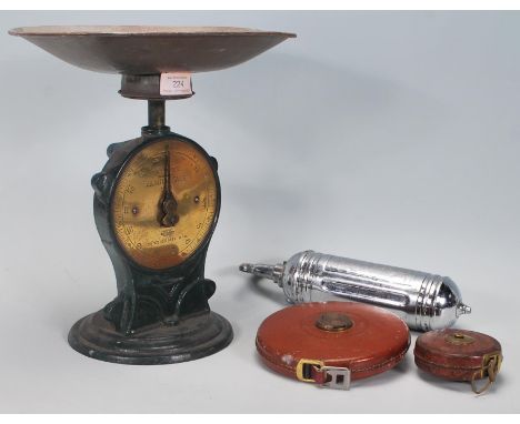 A selection of vintage 20th Century practical items to include a set of salter 'family' scales, a vintage Junior Pyrene fire 