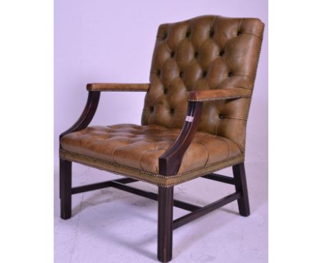 A good quality antique style green leather and mahogany button backed Gainsborough office / desk chair. Raised on squared leg