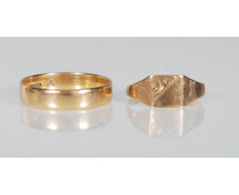 A hallmarked 9ct gold wedding band ring of plain form. Hallmarked Birmingham 1994. Size R.5. Together with a hallmarked 9ct g