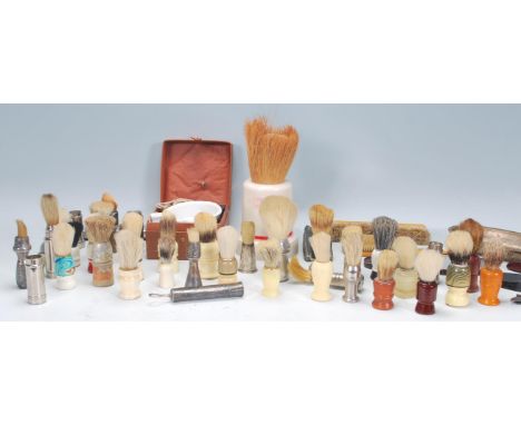 A good collection of vintage 20th Century shaving brushes and other related items to include multiple silverplated examples, 