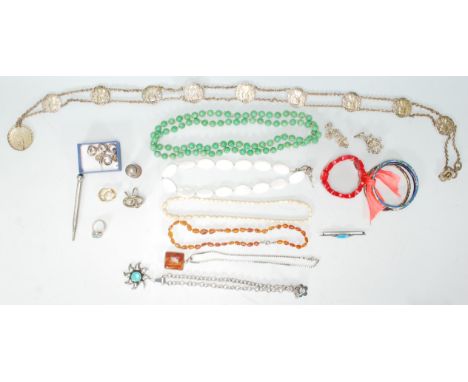 A mixed collection of various jewellery dating from the early 20th Century to include an Art Nouveau belt decorated with ladi