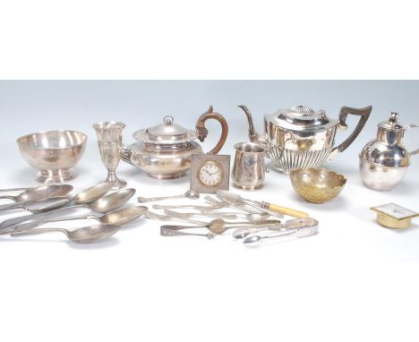 A collection of silver plated wares to include an early 20th century silver mounted alarm clock with Jaeger Le Coutre style f