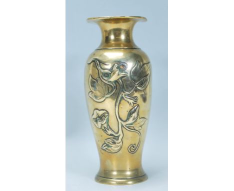 A 20th Century Chinese cast brass vase of baluster form having raised floral branch decoration with flared rim to the top. Me