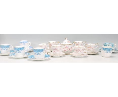 A mixed group of coffee cans / cups and saucers dating from the early 20th Century to include&nbsp;A Paragon Victoriana Rose 