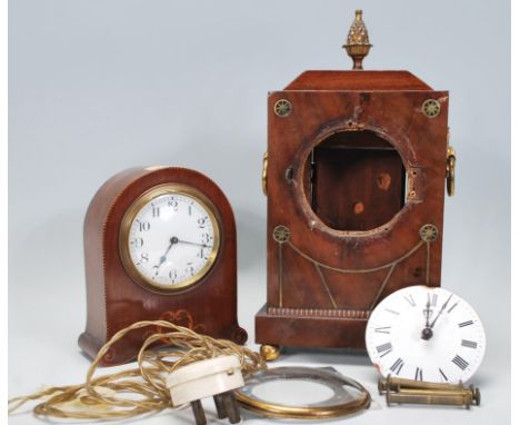 A pair of 20th century mantel clock having white enamel face. The small dome top clock has wind up spring movement with arabi