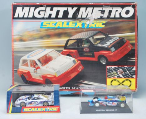 A boxed set of Mighty Metro Scalextric Superscale along with a boxed C2045 Scalextric Porsche Works GT 1 race car and a Scale