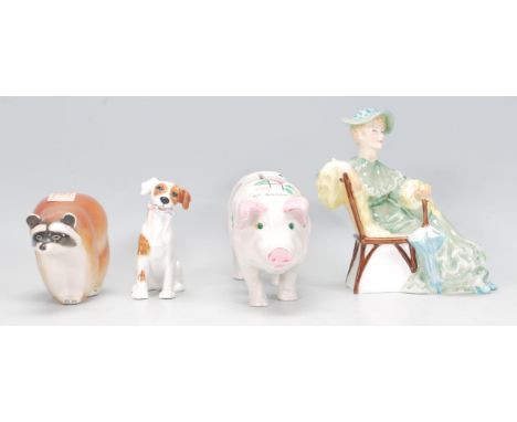 A collection of ceramic figurines to include a Royal Doulton 'Ascot' figurine HN2356, a Royal Doulton dog figurine HN1159, a 