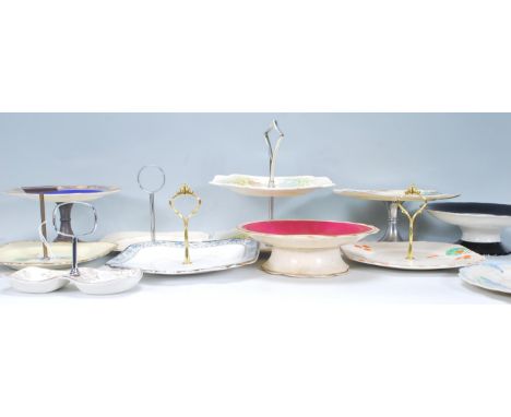 A good selection of early 20th Century mostly Art Deco ceramic cake stands of varying sizes and designs to include a black ri