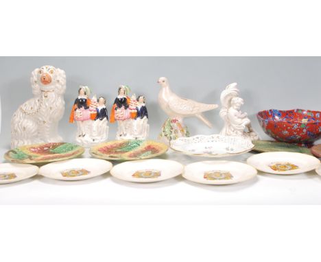 A mixed group of ceramic wares dating from the 19th Century to include a decorative ribbon plate with floral sprays and gilt 