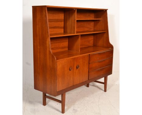 A Jentique 1960's retro vintage teak wood highboard / sideboard credenza having an open bookshelf above a twin door cupboard 