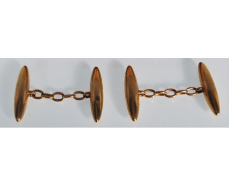A pair of vintage gents gold torpedo shaped cufflinks stamped 18, housed within a leather jewellery box stamped for James Wal