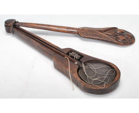 A set of 20th Century Chinese opium scales having a carved wooden case with rotating lid having carved pomegranate design to 