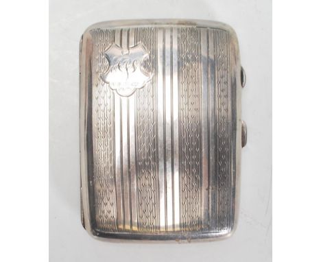 An early 20th Century Art Deco English silver hallmarked cigarette case of rectangular bowed form having engine turned body w