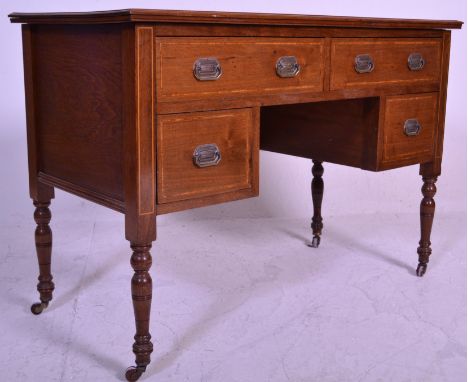 An Edwardian mahogany and leather inlaid writing table desk. Raised on square tapering legs with fitted short and long drawer