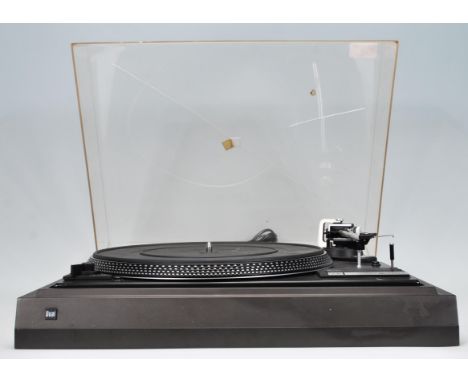 Hi-Fi- A Dual 505 belt drive record player turntable finished in black. Sadly damage to the perspex cover. Measures 44 cm wid