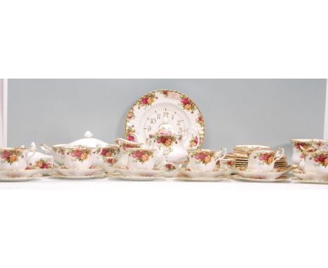 An extensive Royal Albert Old Country Roses china dinner and tea service having red rose decoration and gilt rims, to include