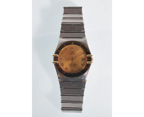 A gentleman's vintage Omega Constellation chronometer quartz watch. Having a round face with a gilt dial and roman numerals t