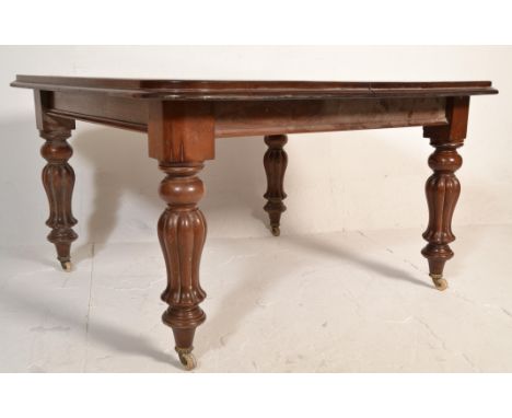 A good 19th century Victorian mahogany extending dining table having a square large top with chamfered edge detailing. All ra