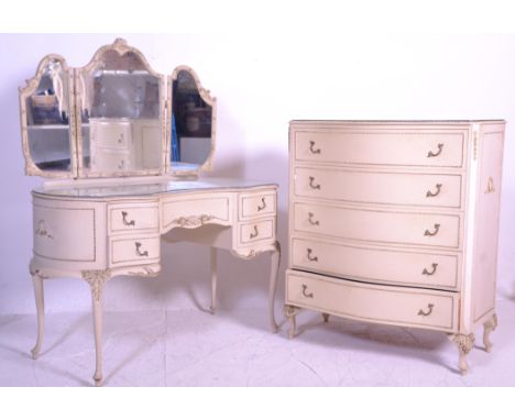 A 19th century Louis style suite comprising a serpentine fronted chest of drawers and a matching mirror back dressing table h