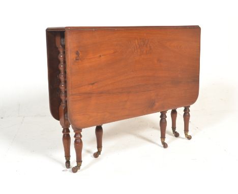 A late Victorian mahogany inlaid Sutherland side table with gate leg action raised on bobbin turned legs united by stretchers