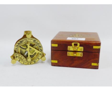 F.L. West modern brass ships style miniature compass in a fitted case, compass 9cm wide