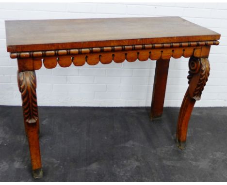 Oak console table with a pierced apron and leaf carved supports, 85 x 102cm