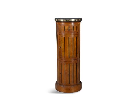 A MAHOGANY AND BRASS MOUNTED PEDESTAL DRINKS CABINET, MODERN with brass platform top, above a fluted cylindrical body fitted 