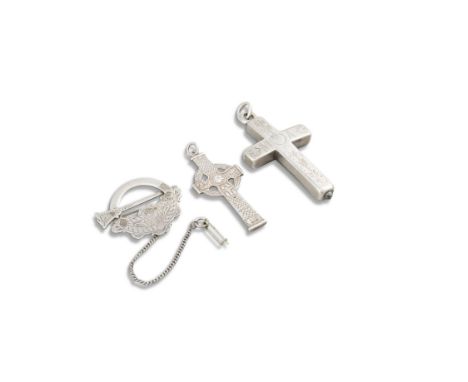 A SILVER RELIQUARY CRUCIFIX, of hollow construction, the hinged cover with screw fastening reveal compartments for the storag