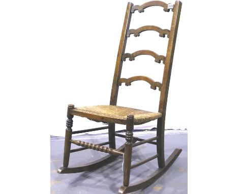 19th century oak framed country rocking chair with rushed seat and ladder back. Not available for in-house P&amp;P, contact P