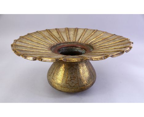 A LARGE ISLAMIC ENGRAVED BRASS BASIN, with engraved broad rim and bulbous body, 40cm diameter.