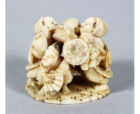 A GOOD JAPANESE MEIJI PERIOD CARVED IVORY NETSUKE OF MUSICIANS, the trio together, each playing an instrument, the base with 