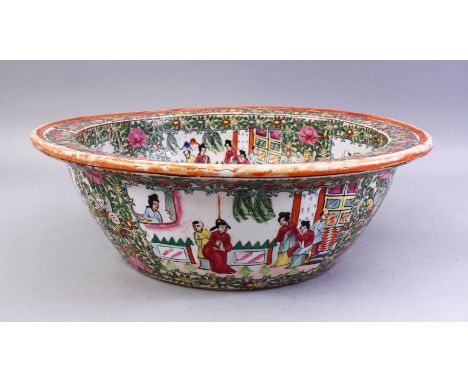 A GOOD LARGE CHINESE CANTON FAMILLE ROSE PORCELAIN BASIN, decorated with panels of figures in gardens and landscapes, birds a