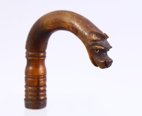 A GOOD 19TH CENTURY CHINESE CARVED RHINO HORN DOG WALKING STICK HANDLE, the handle carved to depict a dogs head, 10cm x 9cm, 