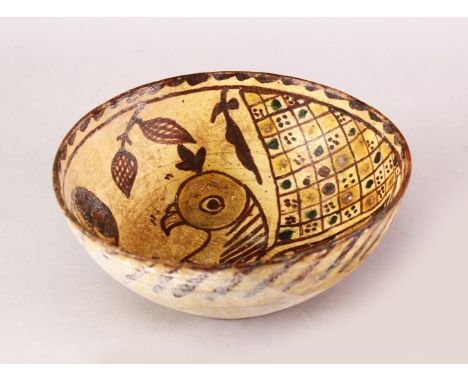 AN EARLY ISLAMIC CERAMIC BOWL WITH BIRD MOTIF, 20cm diameter.