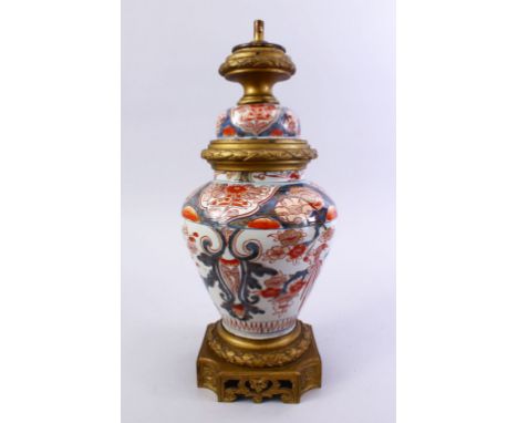 A JAPANESE 18TH / 19TH CENTURY IMARI PORCELAIN VASE  LAMP &amp; COVER, the vase decorated with typical imari palate depicting