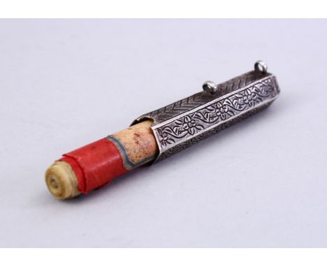 A GOOD ISLAMIC WHITE METAL MANUSCRIPT HOLDER - WITH MANUSCRIPT, The small script holder carved with flora, containing a small