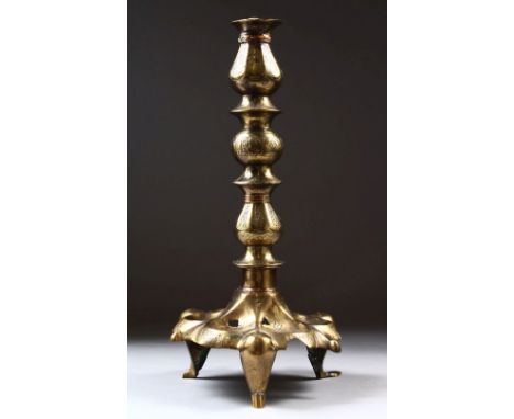 A 13TH CENTURY SELJUK KORASHAN PERSIAN ISLAMIC COPPER INLAID BRASS OIL LAMP STAND, with carved decoration in panels, 36cm hig