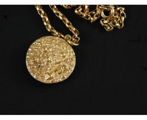 A 9ct gold Apollo II pendant and chain, the circular pendant with crater and astronaut scene, and to the rear marked Apollo I