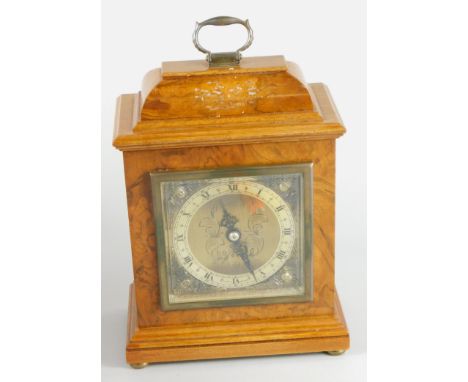 An Elliott mantel timepiece, in fitted walnut case, bearing presentation plaque 'Presented for Long Service to Roy Line by th