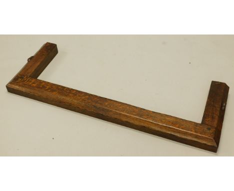 An early Robert of Kilburn 'Mouseman' Thompson oak fender, of plain form with a moulded edge, carved with typical mice to eac