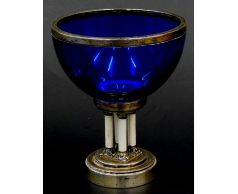 A 19thC German blue glass pedestal bowl, with white metal collar, on four white guilloche enamel columns and circular stepped