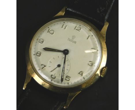 A 1950s Tudor Rolex gentleman's 9ct gold wristwatch, having cream dial with applied Arabic Numerals, seconds subdial to 6 O'c