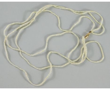 A dainty three strand seed pearl necklace, 3cm length.