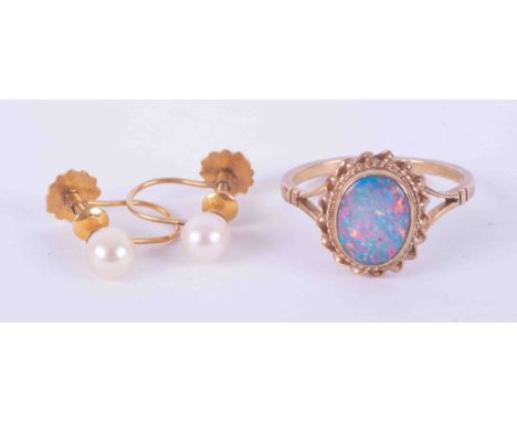 A 9ct gold and opal set ring, together with a pair of pearl 9ct gold earrings, each cased.