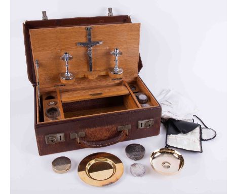 A communion cased set, fitted with an arrangement of various silver containers, EP candlesticks, silver circular box marked A