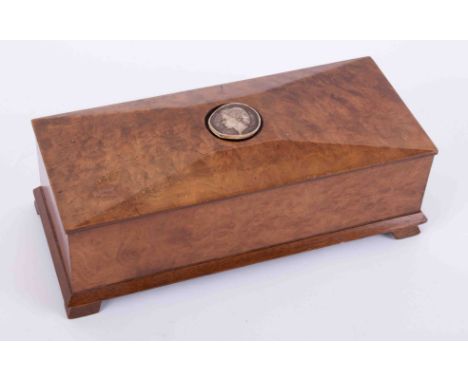 A 20th Century burr walnut box with carved portrait set in the lid, length 25cm.