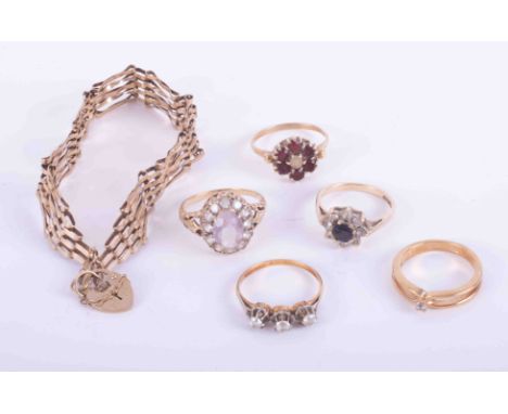 A bag of mixed 9ct yellow gold jewellery to include four x gem set rings, total weight 10.57gm &amp; a 9ct yellow gold gate b